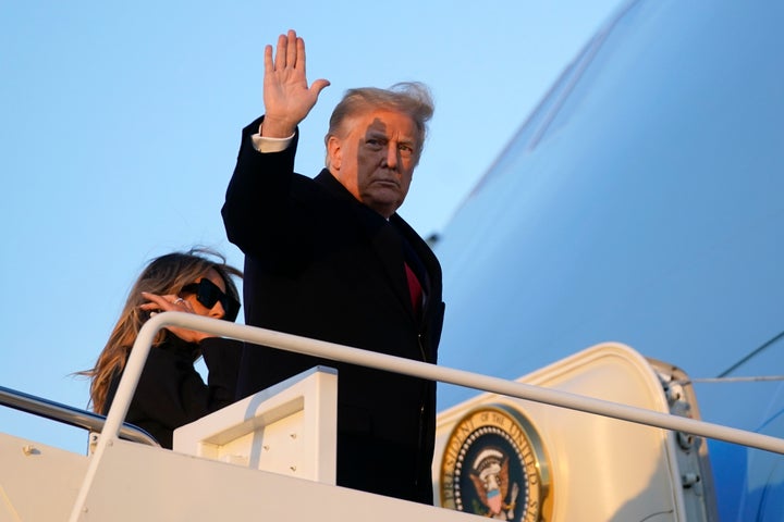 President Donald Trump waves as he boards Air Force One at Andrews Air Force Base, Md., Wednesday, Dec. 23, 2020. (AP Photo/P