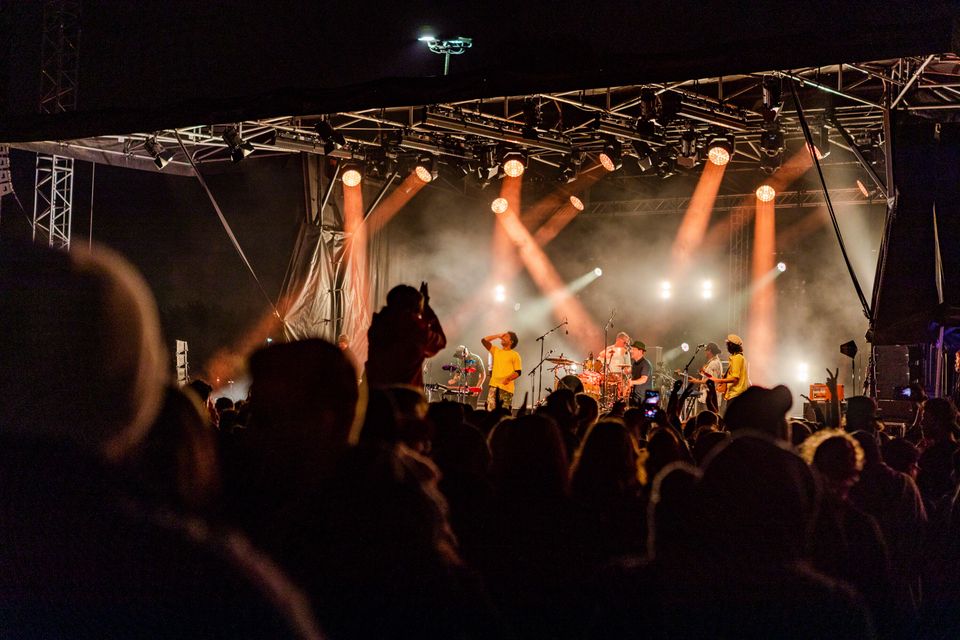 People watch New Zealand band The Black Seeds perform during New Year's Eve celebrations at Hagley Park in Christchurch.