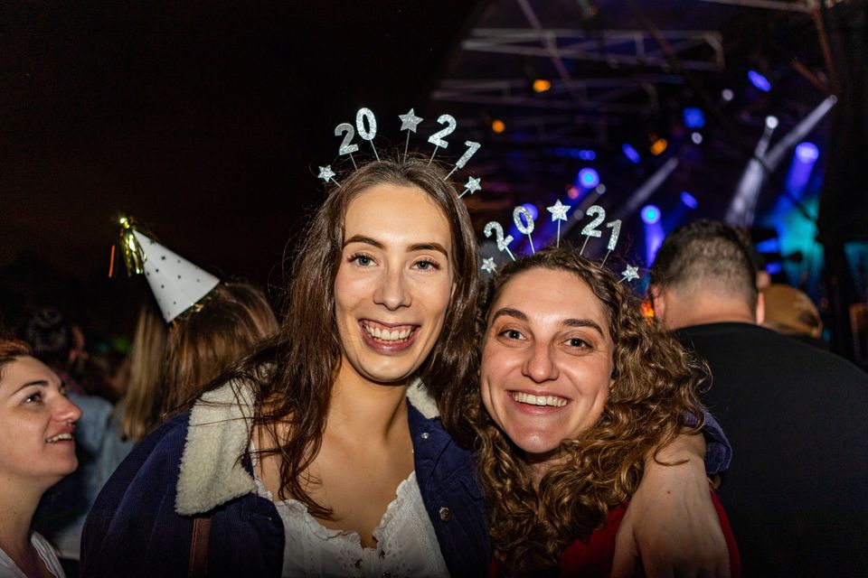 Sophie Jackson and Monique Lee, both from Christchurch, attend New Year celebrations.