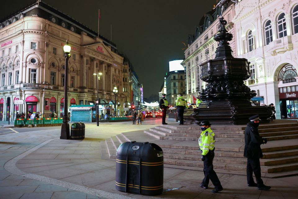 Police officers are pictured at Piccadilly Circus during New Year's Eve.