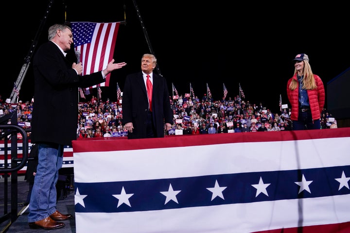 Sen. David Perdue (R-Ga., left) speaks as President Donald Trump and Sen. Kelly Loeffler (R-Ga.) listen at a campaign rally in Valdosta, Georgia, on Dec. 5.