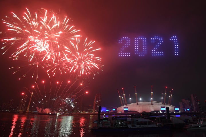 Fireworks and drones illuminate the night sky over the The O2 in London as they form a light display as London's normal New Y