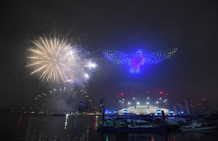 Fireworks and drones illuminate the night sky over London as they form a light display as London's normal New Year's Eve fireworks display was cancelled due to the coronavirus pandemic.