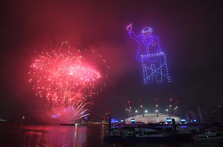 Fireworks and drones illuminate the night sky over London as they form a light display as London's normal New Year's Eve fireworks display was cancelled due to the coronavirus pandemic.