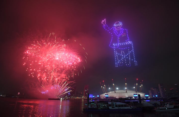 Fireworks and drones illuminate the night sky over London as they form a light display as London's normal New Year's Eve fireworks display was cancelled due to the coronavirus pandemic.