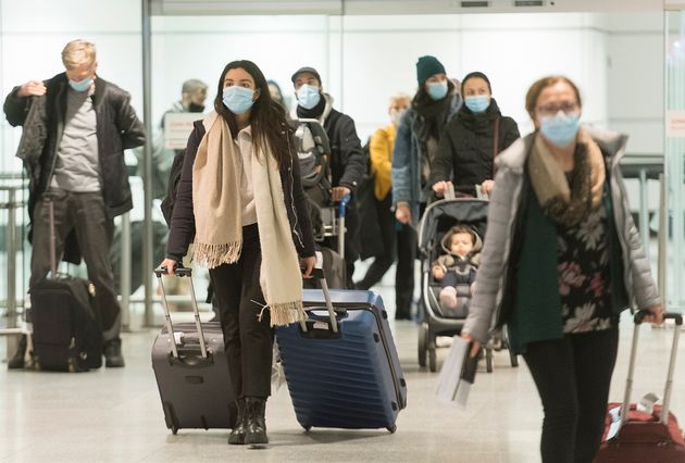 Passengers are shown in the international arrivals hall at Trudeau Airport in Montreal on Dec. 29,