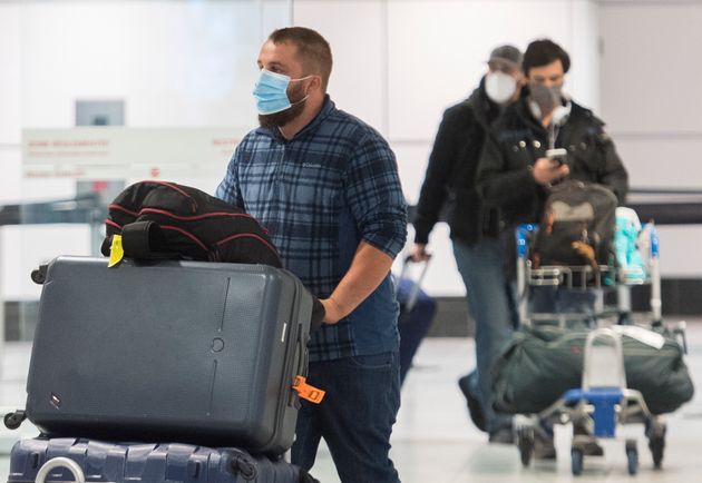 Passengers are shown in the international arrivals hall at Trudeau Airport in Montreal on Dec. 29,