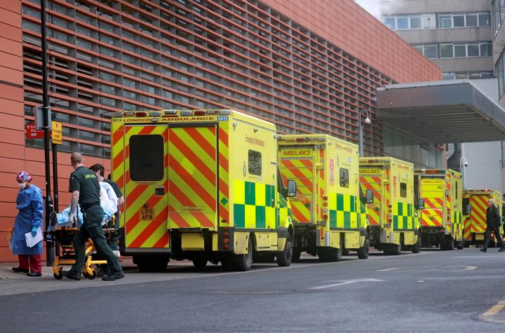 Medics transport a patient from an ambulance to the Royal London Hospital on January 1.