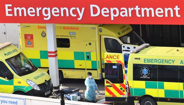 A health worker in PPE cleans equipment outside A&E at St Thomas' Hospital, London, on January 3