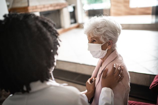 Doctor using stethoscope on a senior patient at home (file picture) 