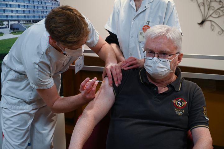 Professor of geriatrics Pierre Jouanny receives a dose of the Pfizer-BioNTech Covid-19 vaccine at the at the Champmaillot nursing home in Dijon, central France, Sunday Dec. 27, 2020.