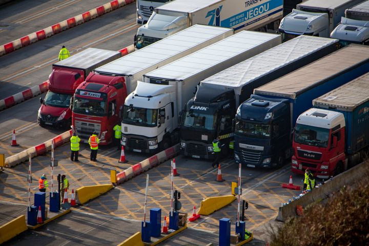 NHS test & trace underway as police and army personnel are stationed at the entrance to the departure lanes of the Port of Dover .