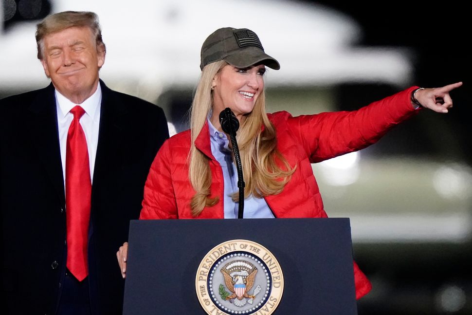 Senator Kelly Loeffler speaks as President Donald Trump listens during a campaign rally in Georgia on Monday.