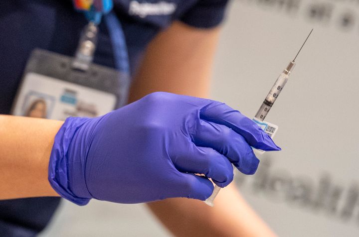 A nurse prepares a syringe of the COVID-19 vaccine for health care workers at Ronald Reagan UCLA Medical Center in Westwood, California. A hospital in Mendocino County administered 830 doses of a coronavirus vaccine in two hours after a freezer outage threatened the supply.
