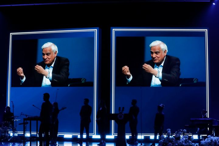 In this May 29, 2020 file photo, images of Ravi Zacharias are displayed in the Passion City Church during a memorial service for him in Atlanta. 