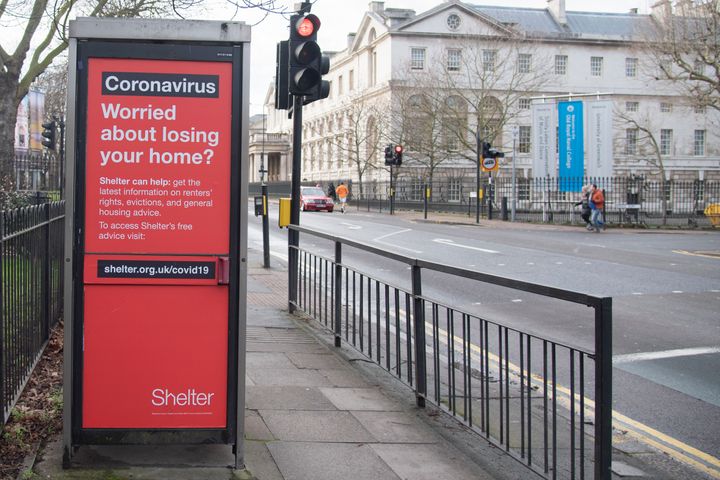 An advert on the side of a telephone box by homeless charity Shelter offering advise to anyone at risk of losing their home during the pandemic