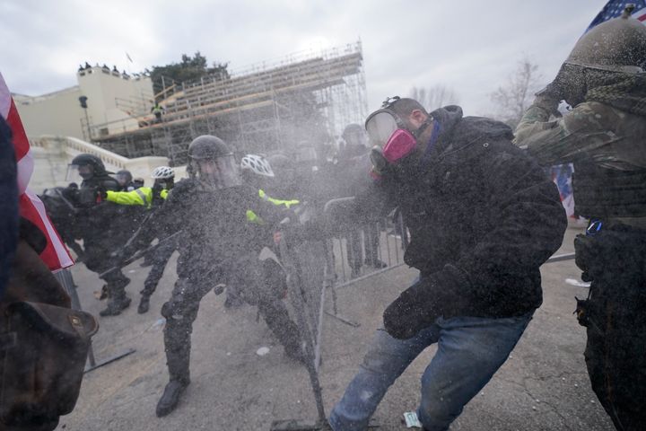 Trump supporters try to break through a police barrier, Wednesday, Jan. 6, at the Capitol in Washington, DC.