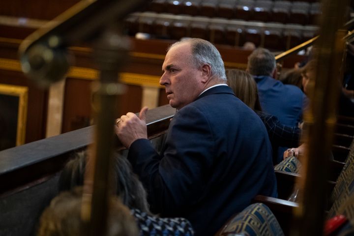 Rep. Dan Kildee, D-Mich., and other members take cover as rioters attempt to break into the House chamber during the joint session of Congress to certify the Electoral College vote on Jan. 6, 2021.