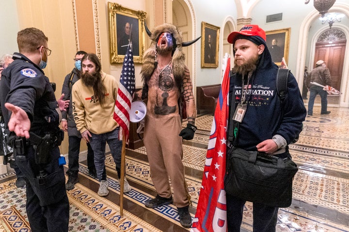 Supporters of President Donald Trump are confronted by Capitol Police officers outside the Senate Chamber inside the Capitol.