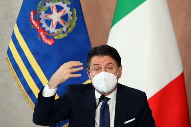 The Italian Premier Giuseppe Conte wearing a face mask during the end of year press conference at Villa...