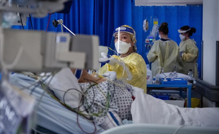 A nurse works on a patient in the ICU (Intensive Care Unit) in St George's Hospital in Tooting, south-west London, this week