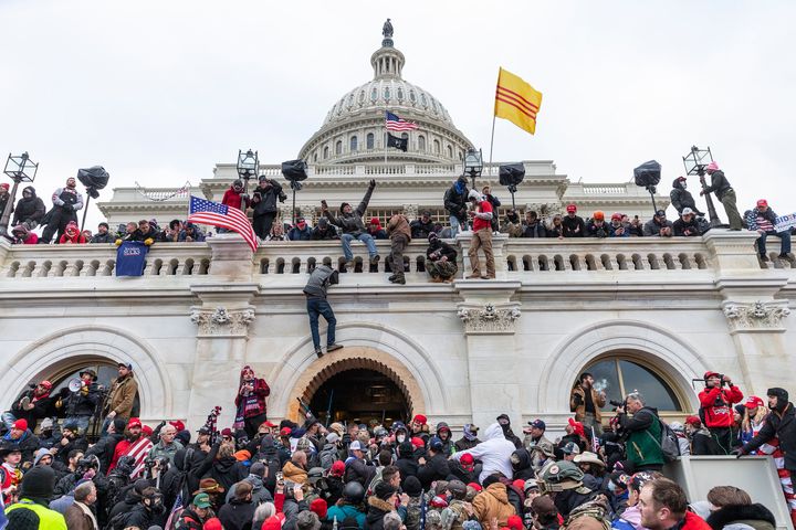 Rioters climbed on and defaced the Capitol as hundreds of insurrectionists breached the home of the legislative branch in an effort to overturn Donald Trump's election loss.