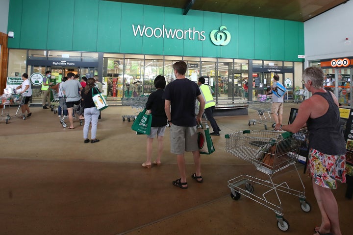 People stand in line outside a Woolworths at a southern suburb of Brisbane on January 08, 2021 in Brisbane, Australia.
