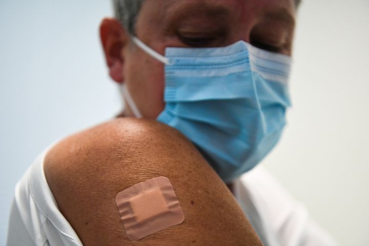 Kate Bingham, Chair of the Government's Vaccine Taskforce, with a plaster on her arm after starting her Novavax trial at the Royal Free Hospital, north London.