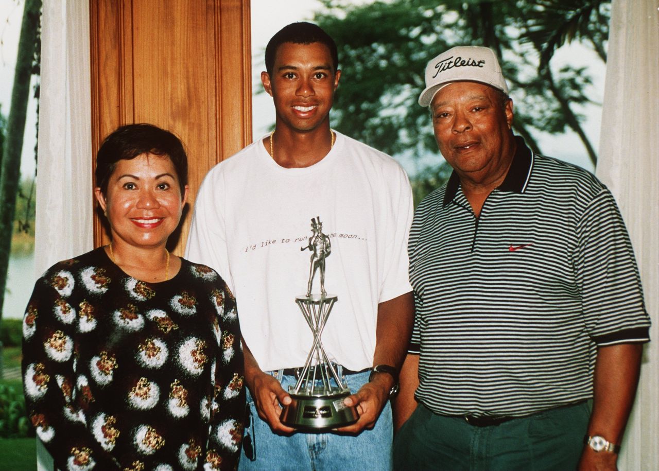 Tiger Woods with his parents Kultida and Earl Woods at the Johnnie Walker Classic at Blue Canyon Golf Club, Thailand, on Jan. 25, 1998.