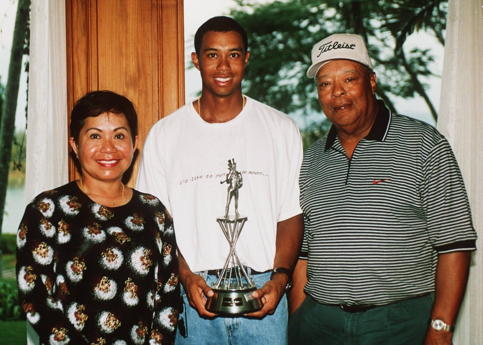 Tiger Woods with his parents Kultida and Earl Woods at the Johnnie Walker Classic at Blue Canyon Golf Club, Thailand, on 