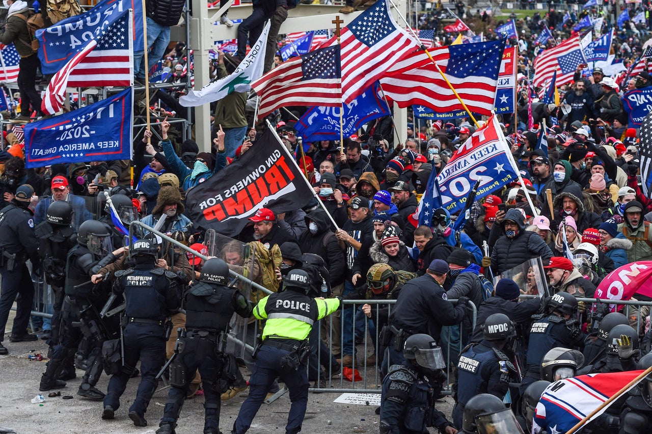 Demonstrators breech security before entering the Capitol to try to stop Congress from certifying the 2020 presidential election. 