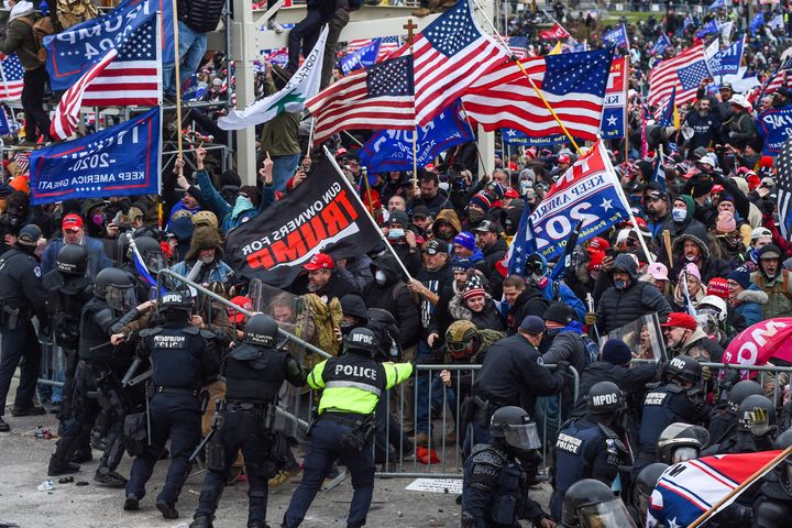 Demonstrators breech security before entering the Capitol to try to stop Congress from certifying the 2020 presidential election. 