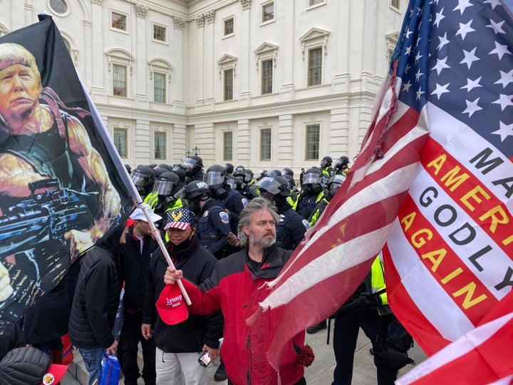 Security forces block the entrance after rioters, including some carrying Christian symbols and signs, breached the U.S. Capi