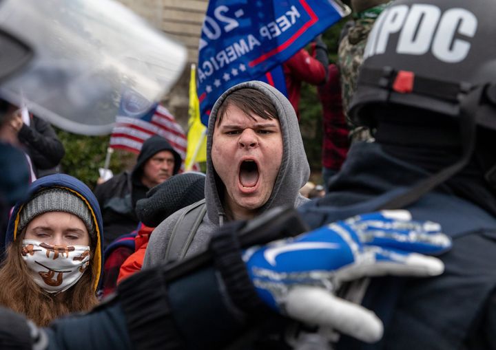 Pro-Trump rioters clash with police Wednesday before a mob broke into the U.S. Capitol.
