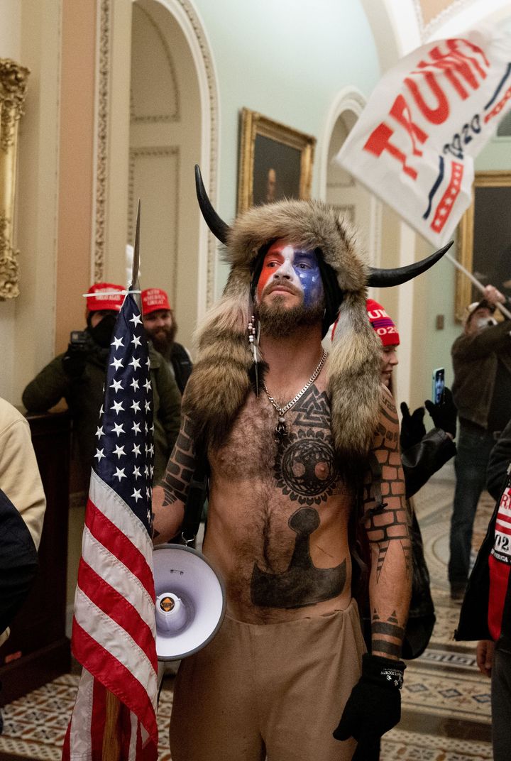 Jake Angeli on Jan. 6 after storming the Capitol as part of the Trump-backed riot.