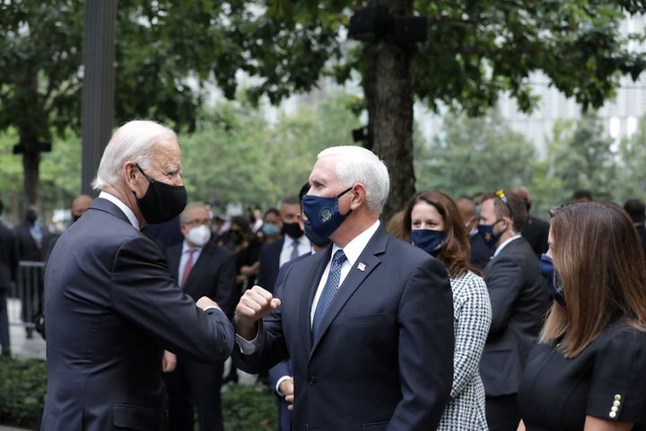 Then-Democratic presidential candidate Joe Biden and Vice President Mike Pence greet each other during the 19th anniversary of the 9/11 attacks on Sept. 11, 2020.