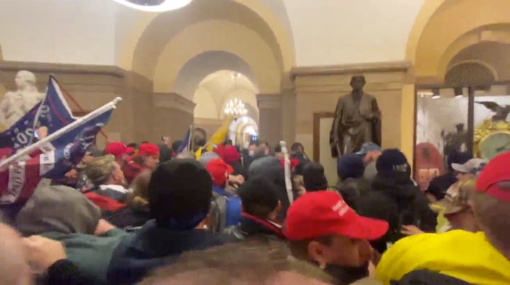 Supporters of President Donald Trump storm the Capitol building in Washington, U.S., January 6, 2021 in this screen grab obta