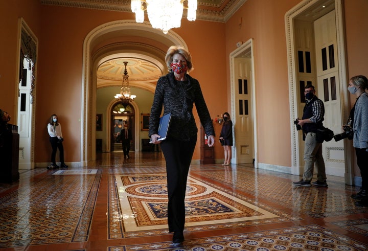 Senator Lisa Murkowski (R-AK) walks to the office of the Majority Leader from the Senate Chamber ahead of a meeting with Sena