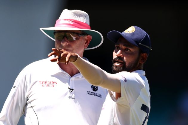 Mohammed Siraj of India stops play to make a formal complaint to Umpire Paul Reiffel about some spectators...