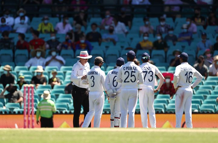 Indian players look to towards a section of crowd where an alleged abusive comment was directed at Mohammed Siraj of India during day four of the Test match in the series between Australia and India at Sydney Cricket Ground on January 10, 2021 in Sydney, Australia.