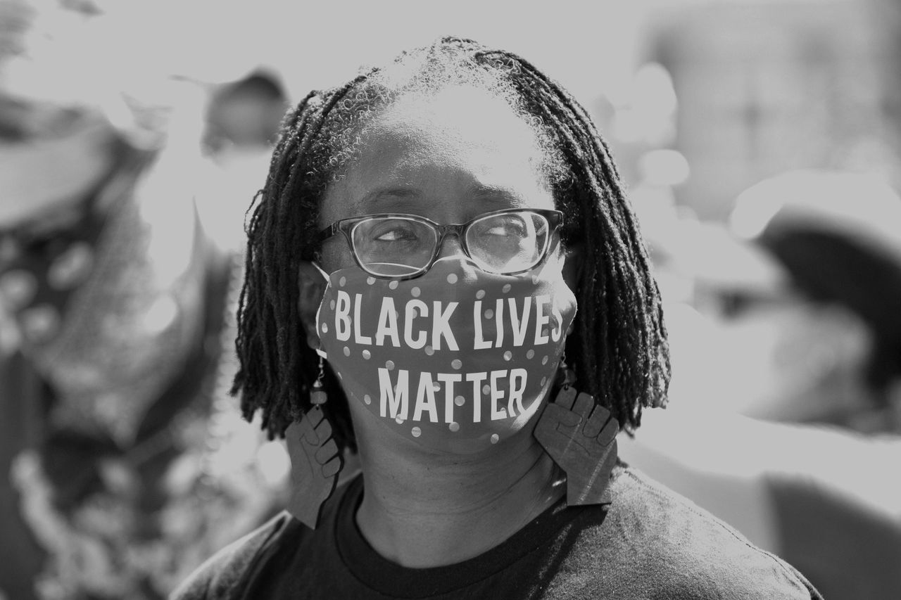 Lisa Woolfork wears a Black Lives Matter mask during a racial justice protest in Charlottesville, Virginia, on May 30, 2020.