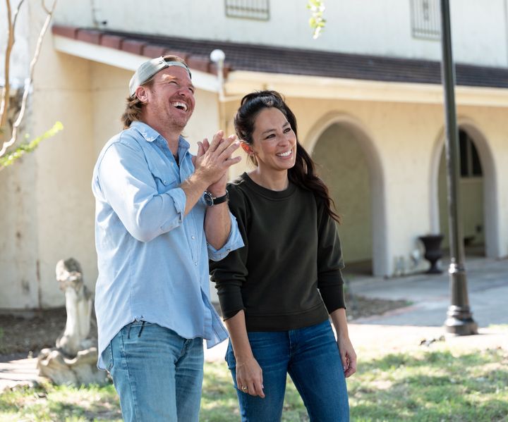 Hosts Chip & Joanna Gaines chat after their walkthrough of the Levings-Holmes house, as seen on "Fixer Upper," Season 6.