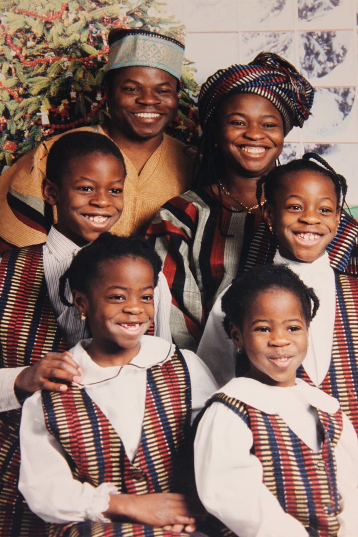 The writer's family wearing traditional Nigerian outfits.