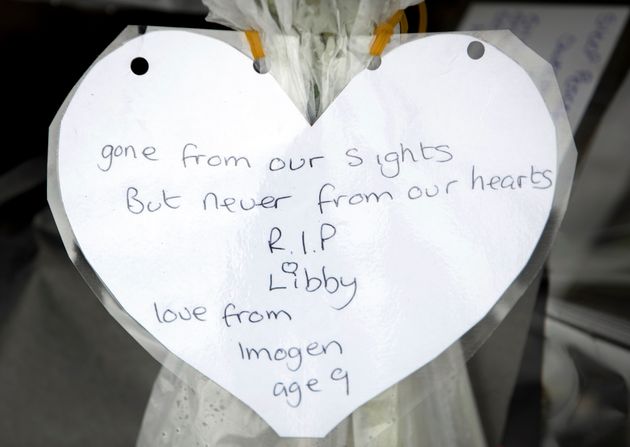 Floral tributes and messages left on the bench where university student Libby Squire was last seen alive, in Hull Yorkshire, after her body was found in the Humber Estuary.