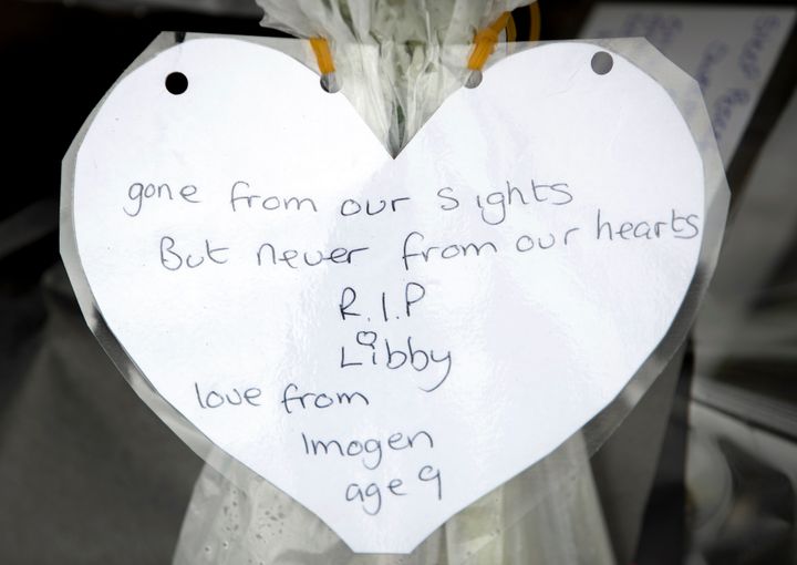 Floral tributes and messages left on the bench where university student Libby Squire was last seen alive, in Hull Yorkshire, after her body was found in the Humber Estuary.