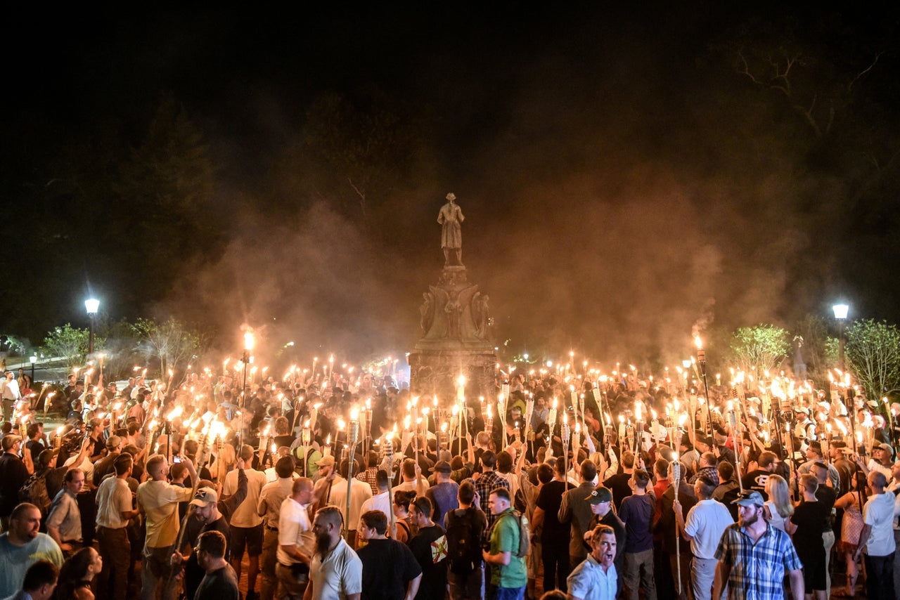 White nationalists participate in a torch-lit march on the grounds of the University of Virginia ahead of the Unite the Right Rally in Charlottesville, Virginia on Aug. 11, 2017.