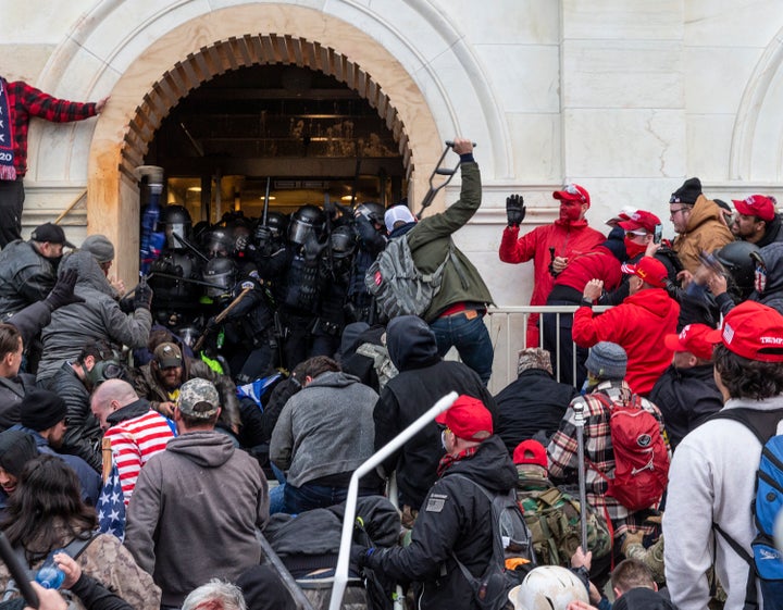 Rioters attacked police as they tried to enter the Capitol building through the front doors. One Capitol Police officer was killed.