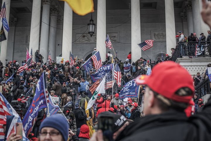 Trump supporters take the steps on the east side of the U.S. Capitol building on Jan. 6, 2021, in Washington, D.C.