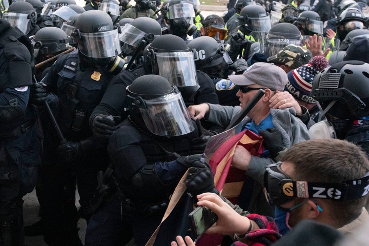 Police clash with pro-Trump rioters outside the U.S. Capitol on Jan. 6.