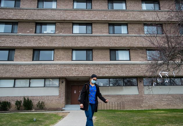 A health-care worker leaves after finishing her shift for the day at the Eatonville Care Centre in Toronto...